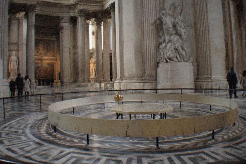 The interior of the Panthéon with the Foucault pendulum swinging beneath the central dome