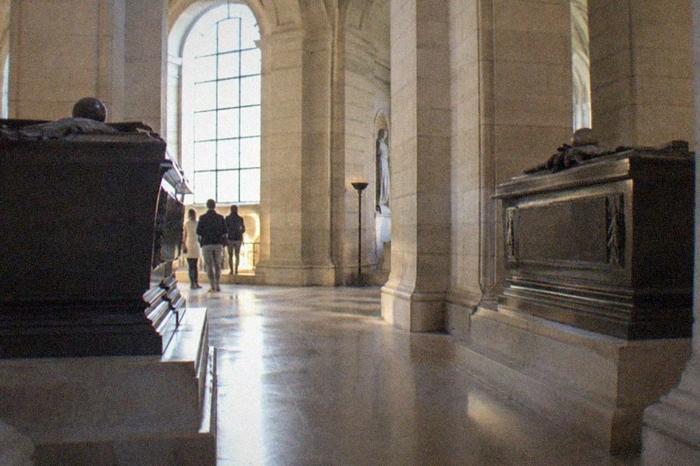 The crypt of the Panthéon with the tombs of Voltaire and Rousseau facing each other