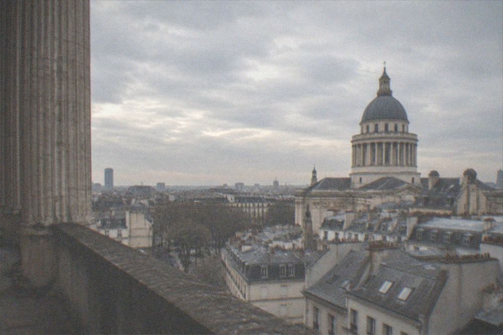The Panthéon's dome seen from the colonnade, with the rooftops of the Latin Quarter stretching toward the Seine