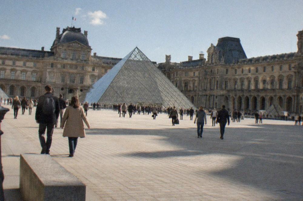 The Louvre palace courtyard with the glass pyramid at its centre