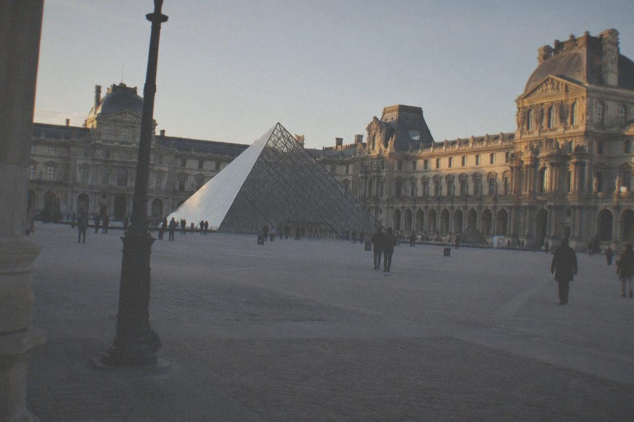 The Louvre palace courtyard with the glass pyramid at its centre