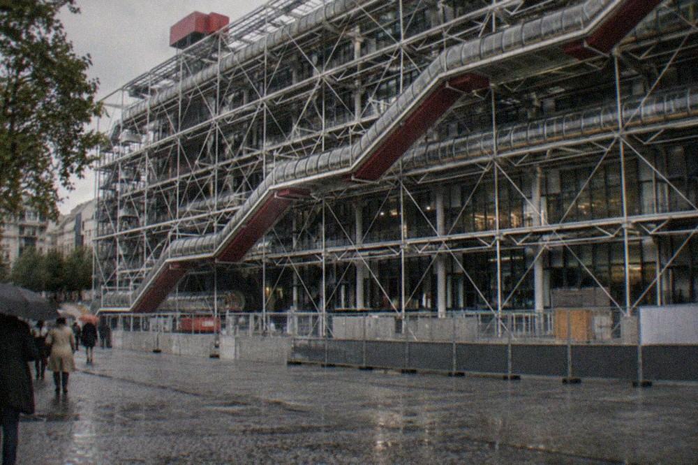 The closed facade of the Centre Pompidou with construction barriers along the plaza