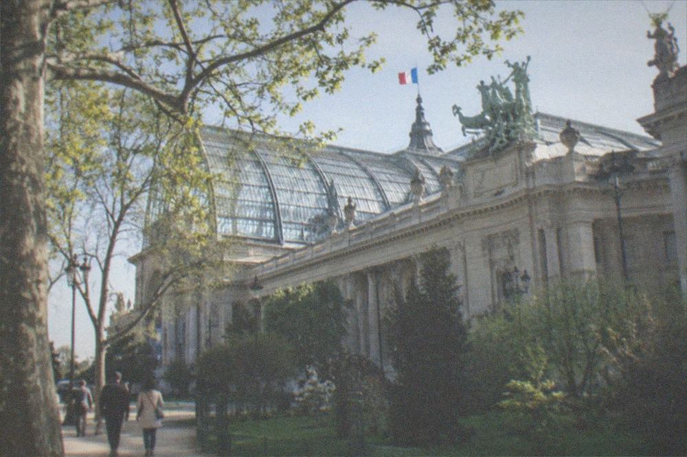 The glass roof and stone facade of the Grand Palais exhibition hall in Paris