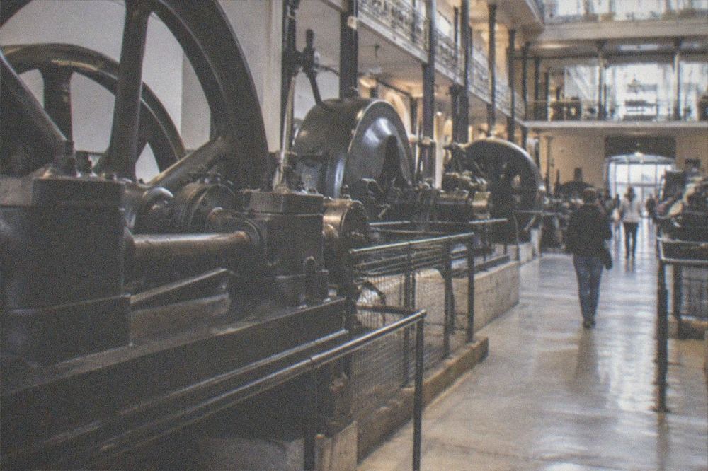 Corridor of industrial machinery and working models in a museum hall