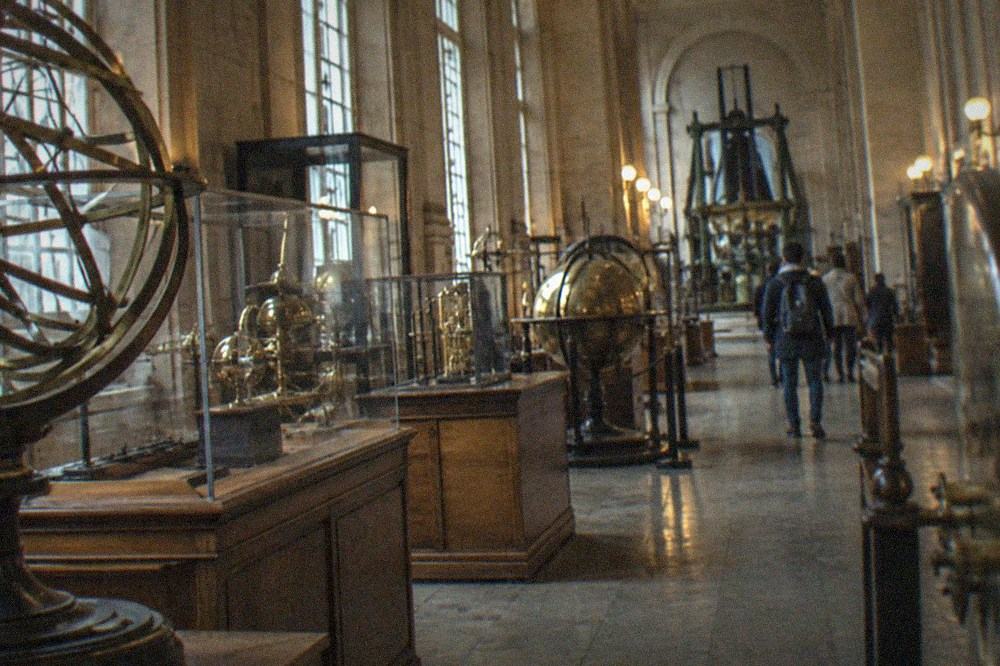 Historic museum hall displaying old scientific instruments and machinery