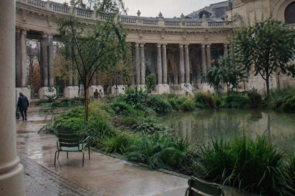 The interior garden courtyard of the Petit Palais with its circular colonnade, ponds and planted greenery