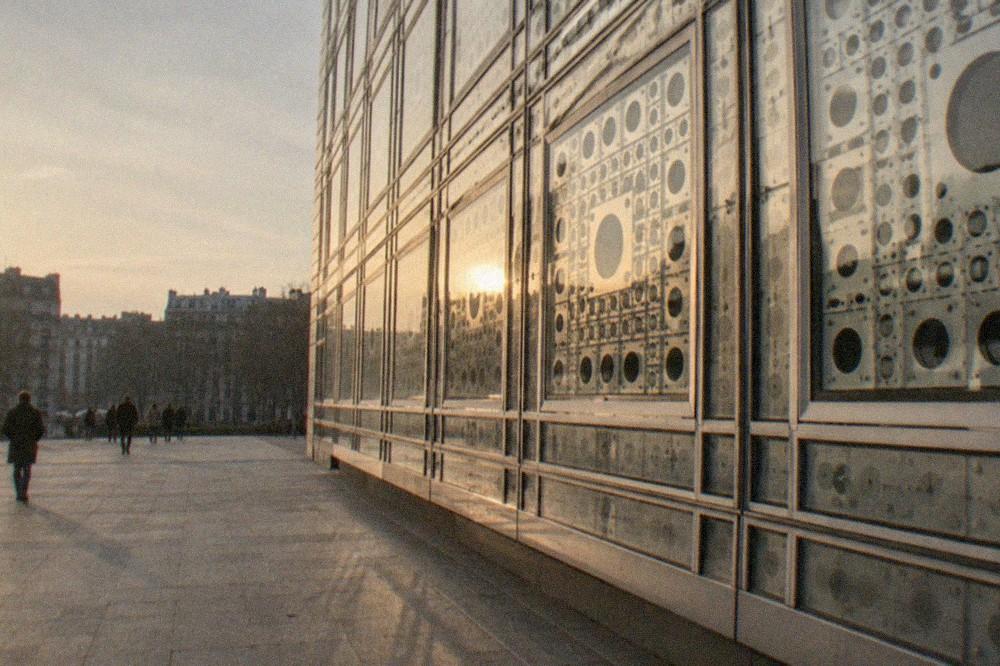 Close view of the metal screen facade of the Institut du Monde Arabe with mechanical apertures
