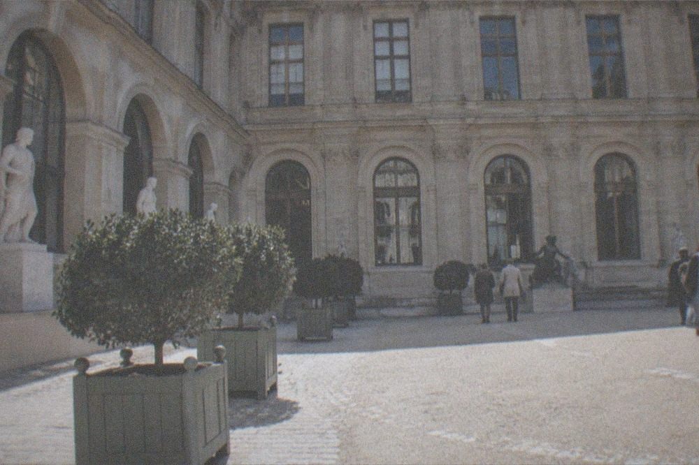 Courtyard of a historic mansion museum with statues and tall windows