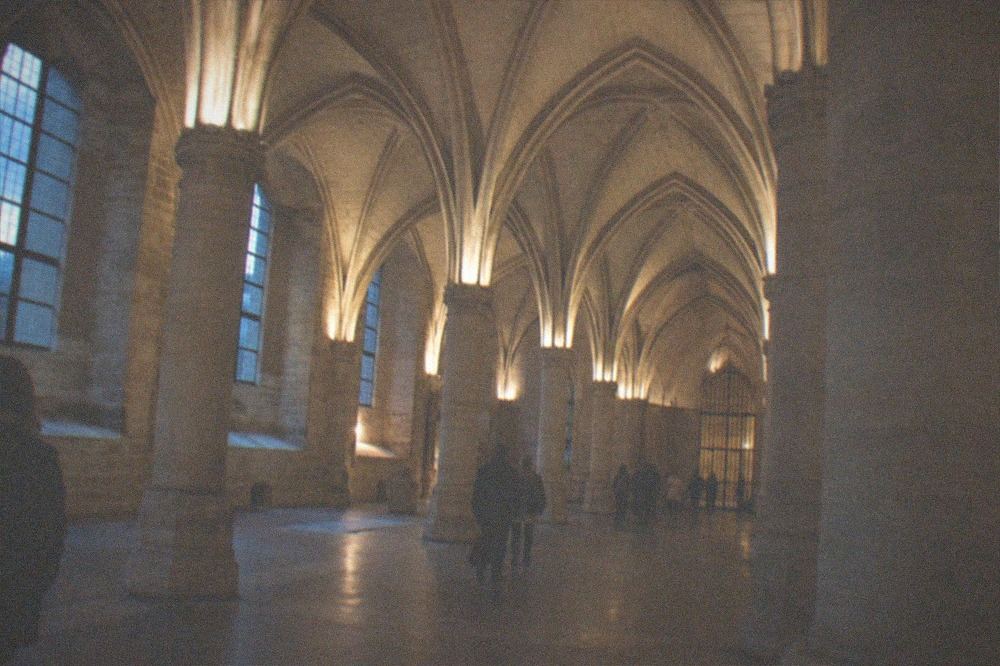 Gothic vaulted medieval hall with stone pillars inside the Conciergerie in Paris