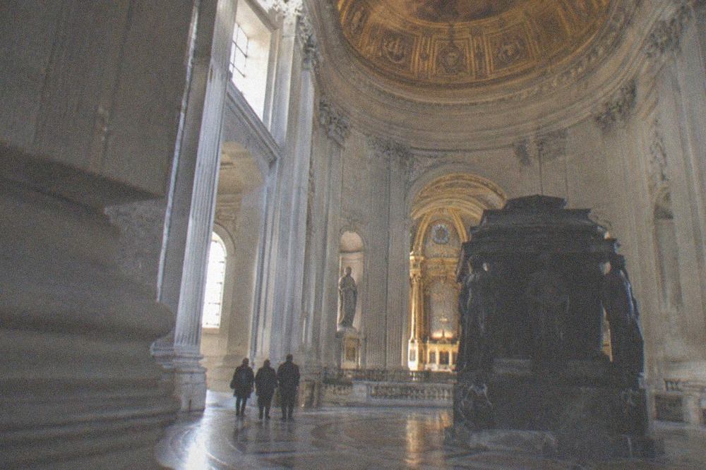 Gilded dome and ornate tomb monument inside the Dôme des Invalides in Paris