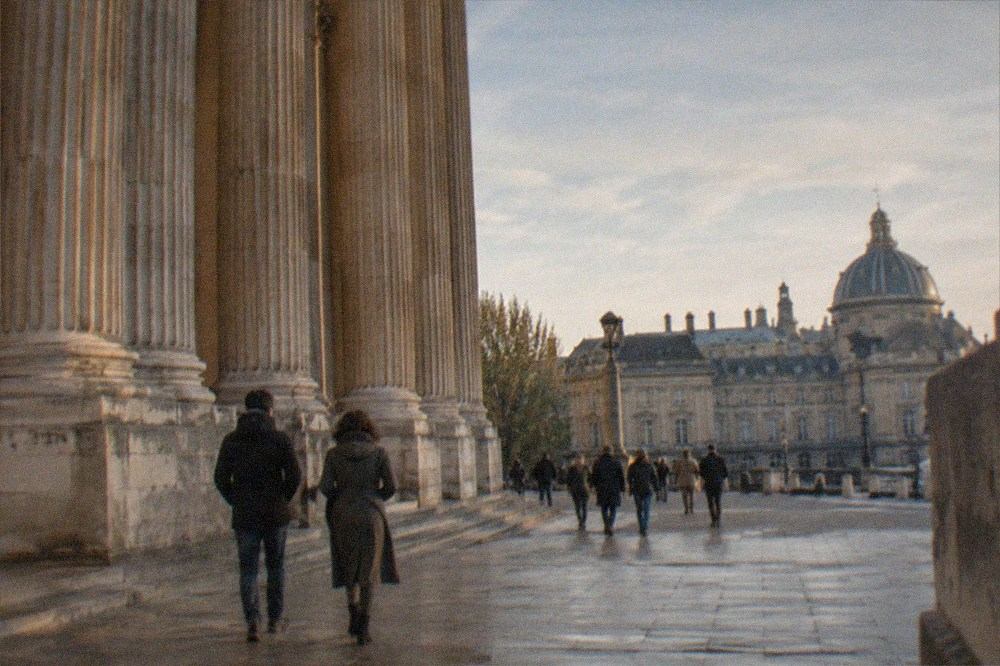 Neoclassical columned facade of a historic monument in Paris at golden hour