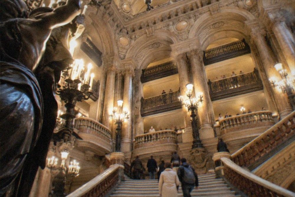 The grand staircase and gilded balconies inside the Palais Garnier opera house seen from below
