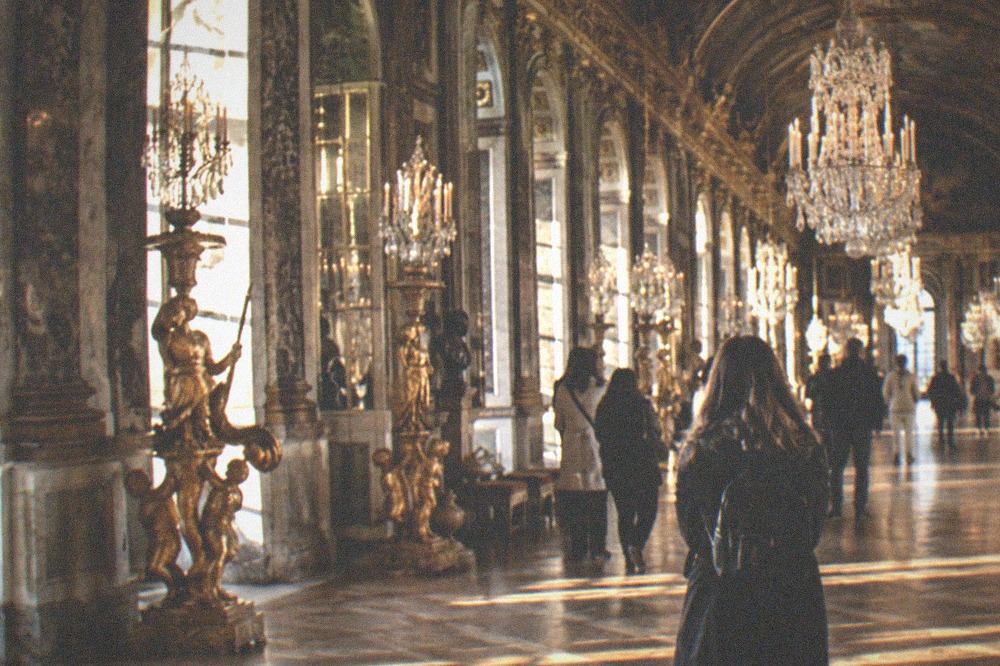 The Hall of Mirrors gallery with chandeliers along its arched ceiling