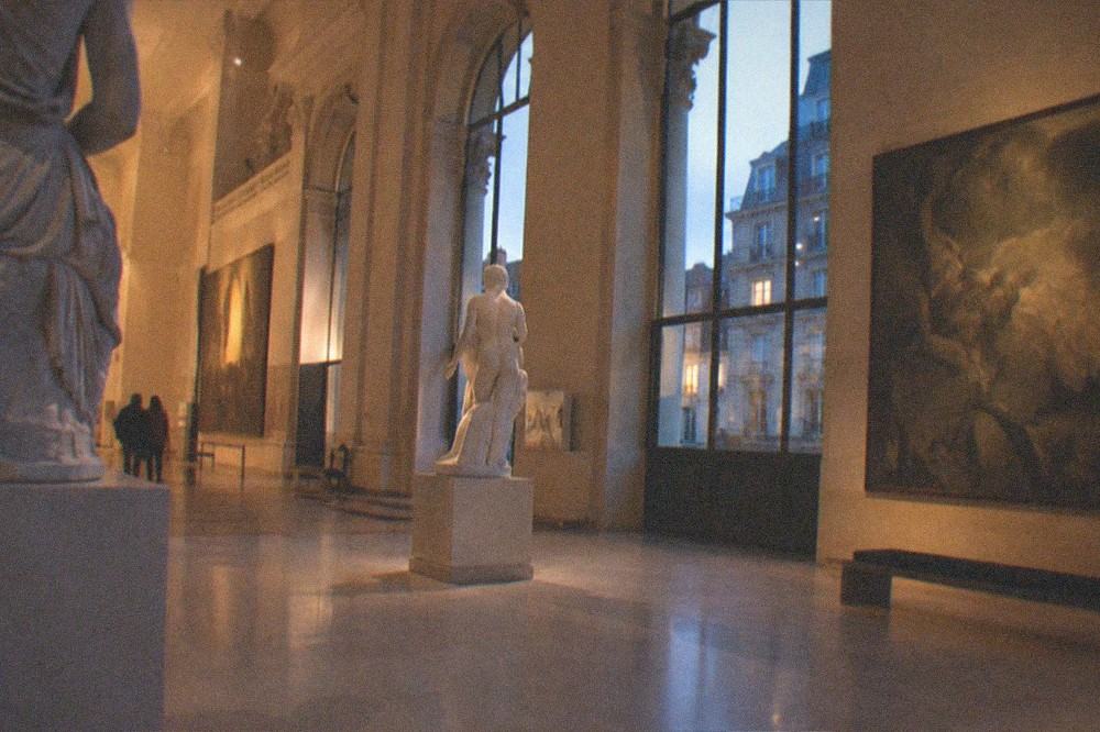 An empty museum gallery lit for an evening visit