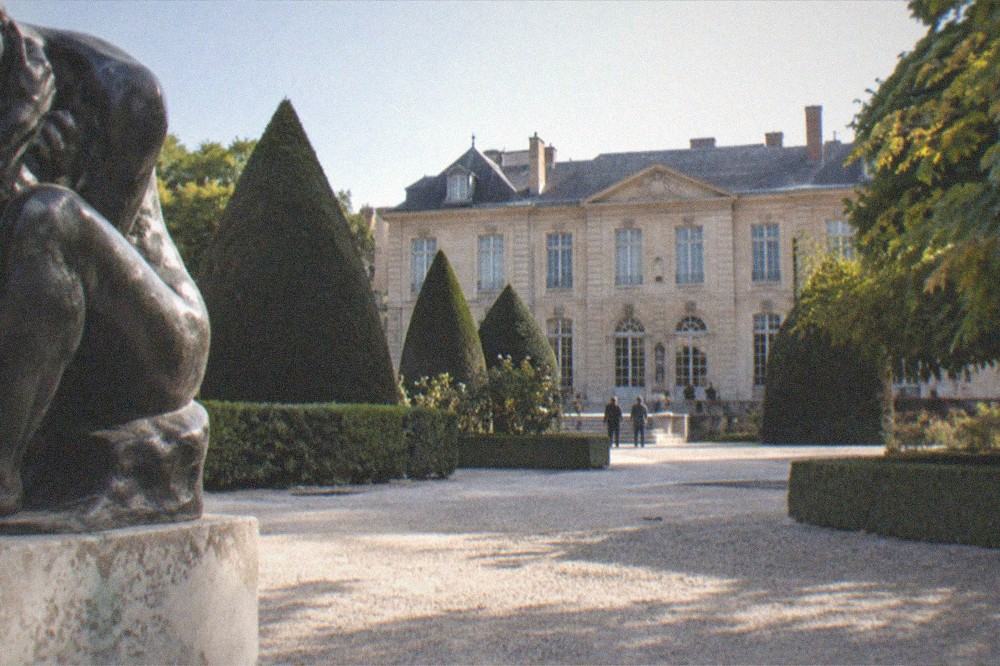 Sculpture garden of the Musée Rodin with the mansion behind hedges